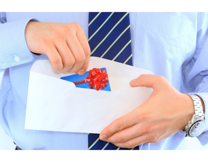 Businessman is sending a pre-approved credit card by mail