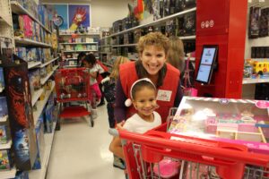 weigel's-family-christmas-volunteer-and-child-shopping-at-target
