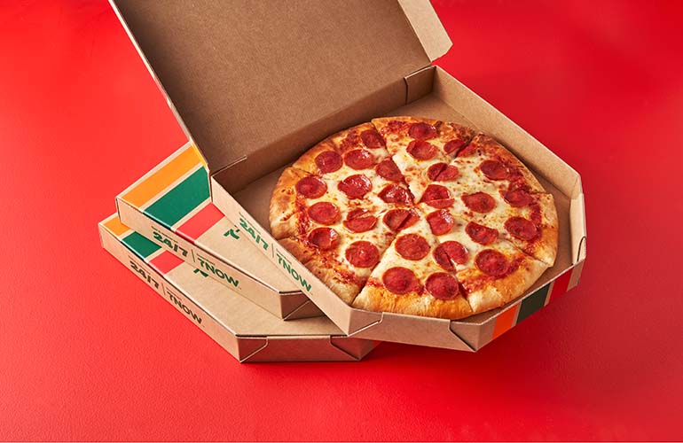 7-eleven-pizza-in-stacked-boxes-red-background.