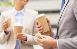 two-people-holding-coffee.