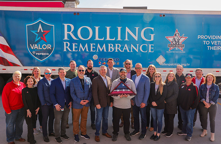 group-of-people-in-front-of-rolling-remembrance-truck.