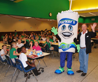 Parker’s president and CEO Greg Parker and Parker's mascot Chewy enjoyed spending time with students at Guyton Elementary.