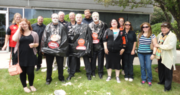 The executive team, store leaders, assistant store leaders and staff from Open Pantry's Racine, Wis. store (9570) pose after the pie throwing event.
