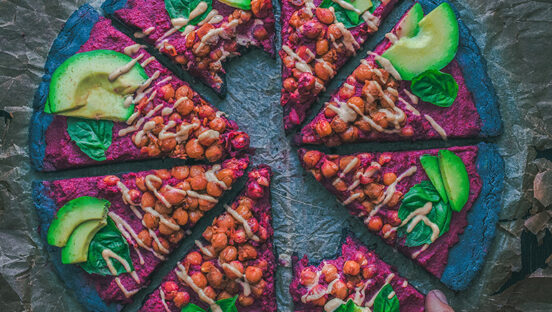 vegan-pizza-in-slices-on-grey-background.