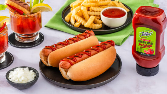 zing-zang-bloody-mary-ketchup-next-to-two-hot-dogs-and-french-fries.